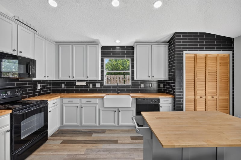 Kitchen with butcher block counters and French doors at 2065 Creekmont Dr