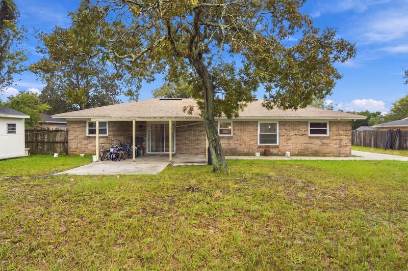 Front exterior with oak tree and lawn at 357 Dillon Dr, Orange Park, FL