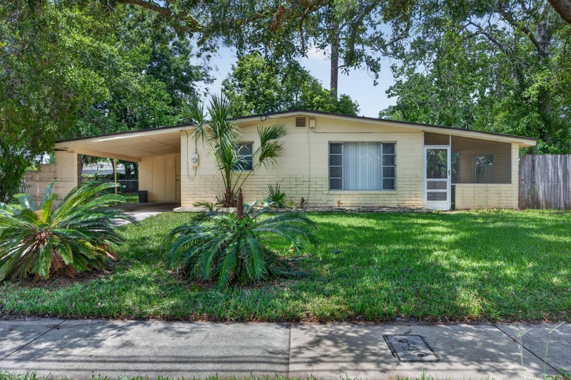 Front yard view with landscaping and walkway at 5527 Beney Rd, Jacksonville, FL 32207