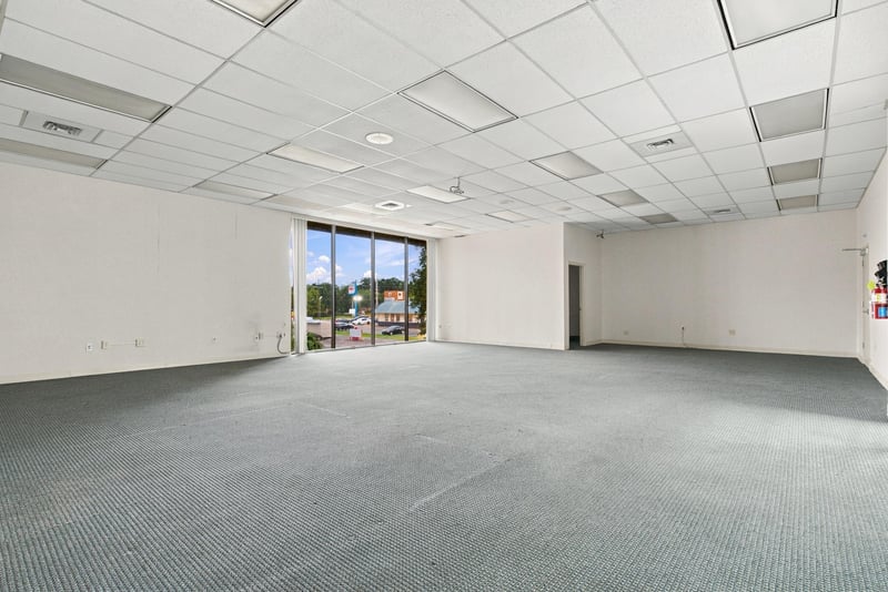 Empty carpeted office room at 101 Scholars Wy