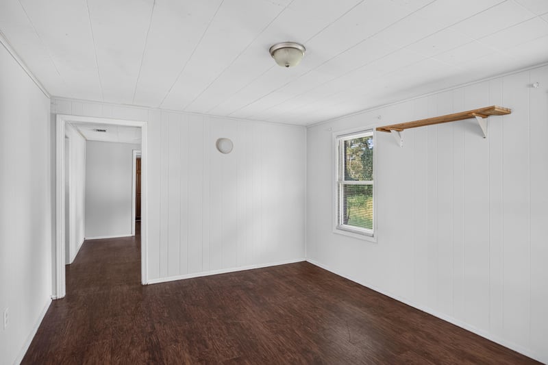Hallway with wood floors and closet doors at 2372 2nd Ave, Jacksonville, FL 32208