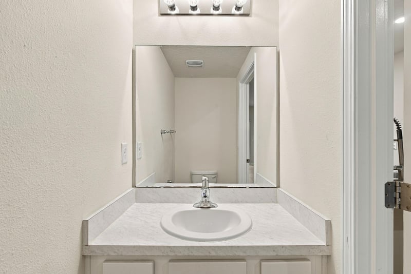 Bathroom vanity close-up with mirror at 9555 Star Dr, Jacksonville, FL 32256