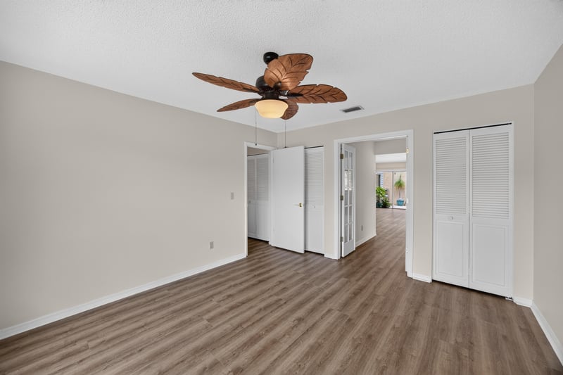 Empty room with hallway and closet doors at 3407 Fairbanks Grant Rd N, Jacksonville, FL 32223