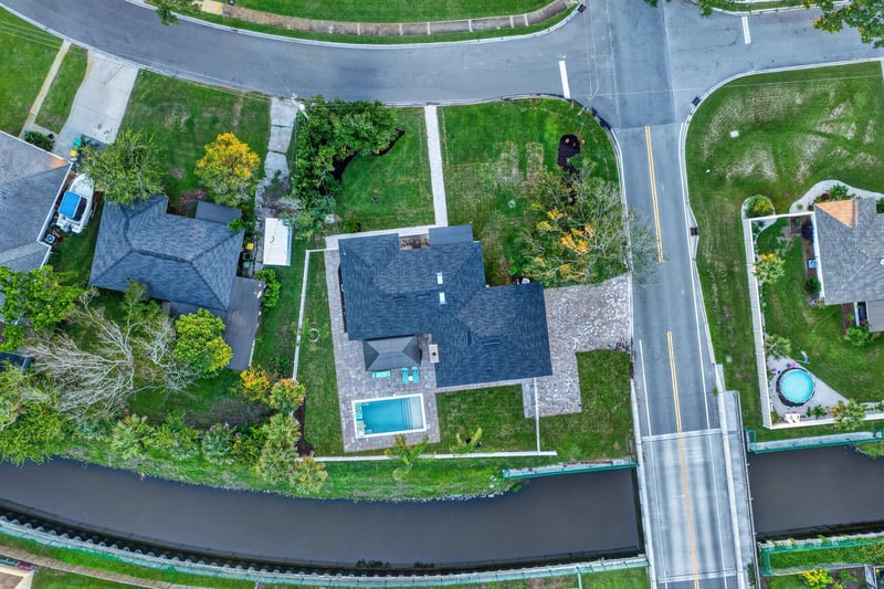 Aerial view of the home along the canal-front street in Jacksonville Beach, FL