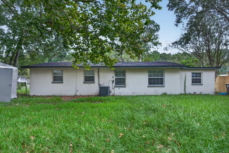Backyard view with storage shed at 5812 Tampico Rd, Jacksonville, FL 32244