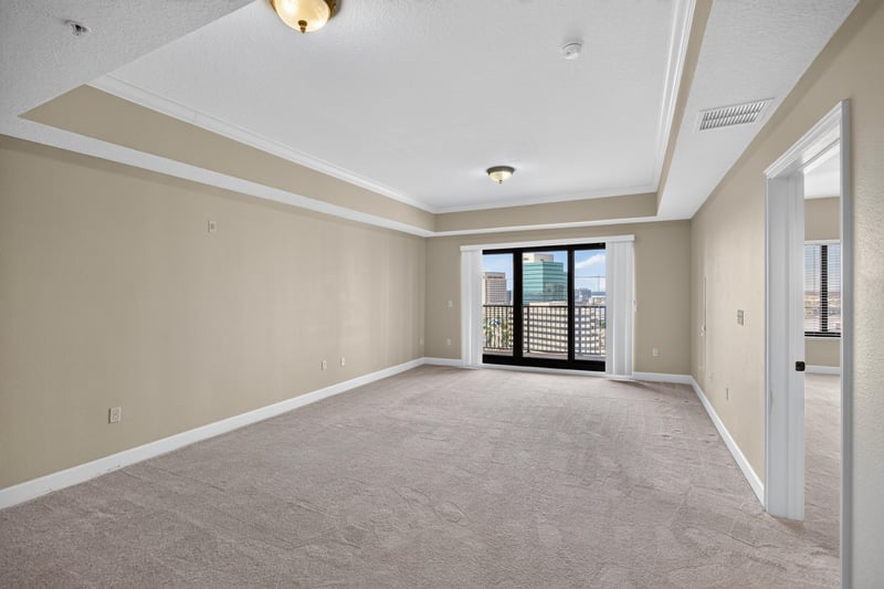 Living room with window and tray ceiling at 1478 Riverplace Blvd 1904, Jacksonville, FL 32207
