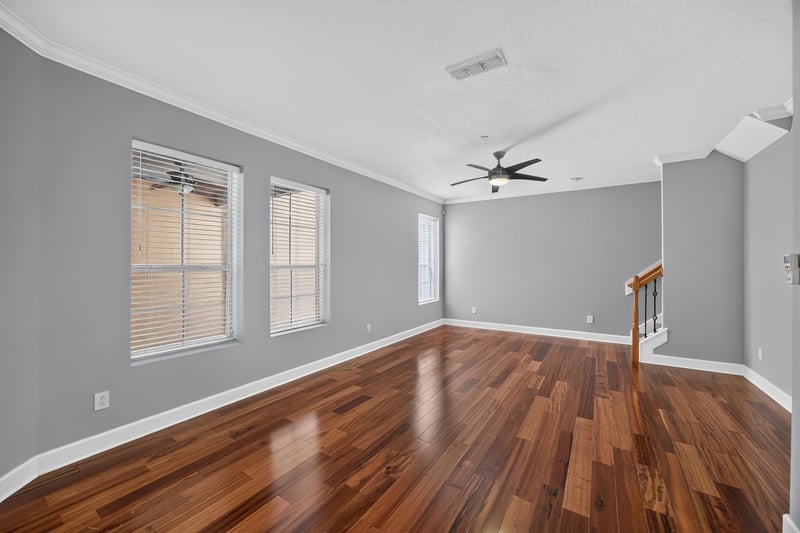 Living room with windows and wood flooring at 6217 Eclipse Cir, Jacksonville, FL 32258