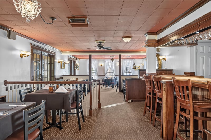 Dining area with red ceiling and table seating at 115 Cordova St, St. Augustine, FL