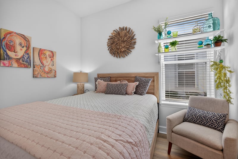 Bedroom with armchair and dresser at 129 Amberwood Dr, St. Augustine, FL