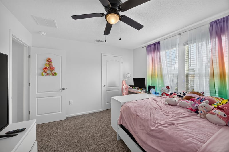 Bedroom with bed and window at 65255 Frst Glen Ln, Yulee, FL 32097