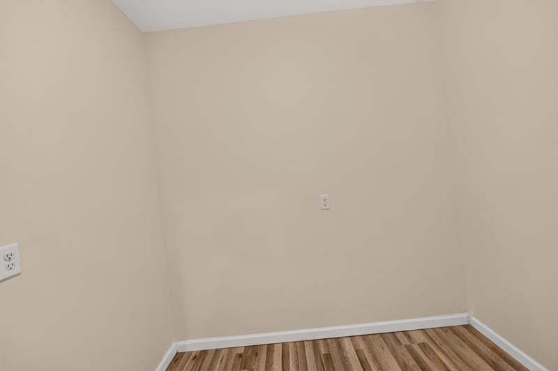 Empty room with wood-look flooring at 1012 Fruit Cove Rd, Jacksonville, FL 32259