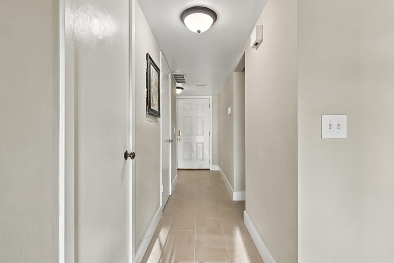 Upstairs hallway with tile flooring at 7703 Las Palmas Way