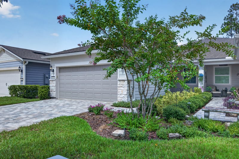 Front exterior close-up of landscaping and entry walk at 171 Oyster Shell Ter, Nocatee, FL 32081