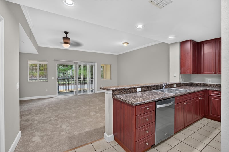 Kitchen open to living area with vaulted ceiling at 9745 Touchton Rd, Jacksonville, FL 32246