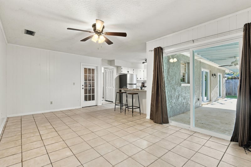 Tile room interior view with sliding door to the patio, photographed by Megapixeler on Crosby Ln, Orange Park