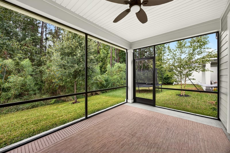 Screened porch with sliding glass doors at 93 Lochloosa Ct, St. Johns, FL 32259