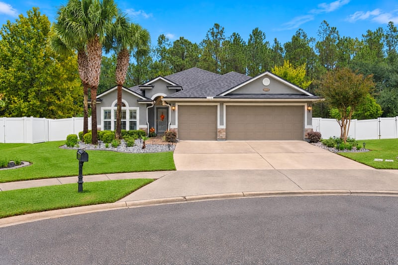 Front exterior with paver driveway and garage at 10923 Black Diamond Ct, Jacksonville, FL