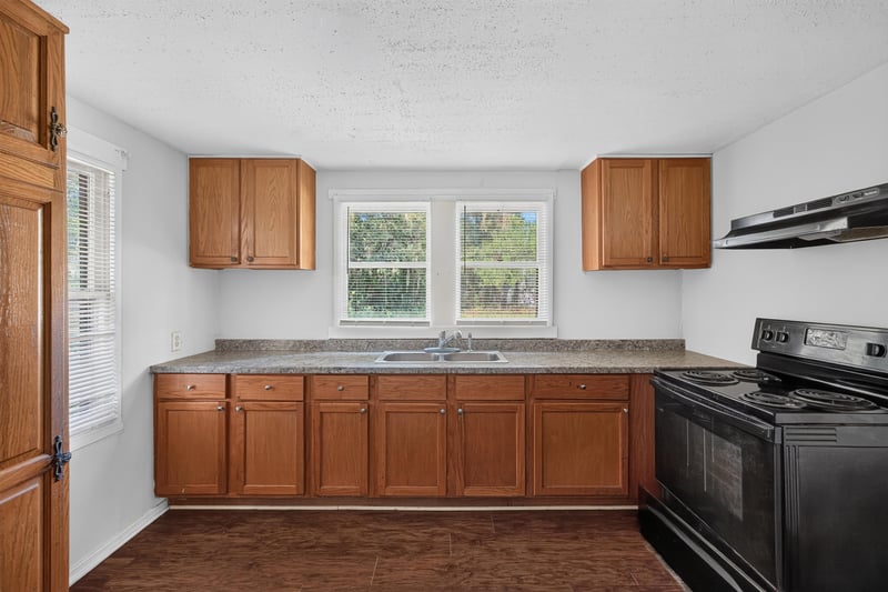 Kitchen with wood cabinets and counters at 2372 2nd Ave, Jacksonville, FL 32208