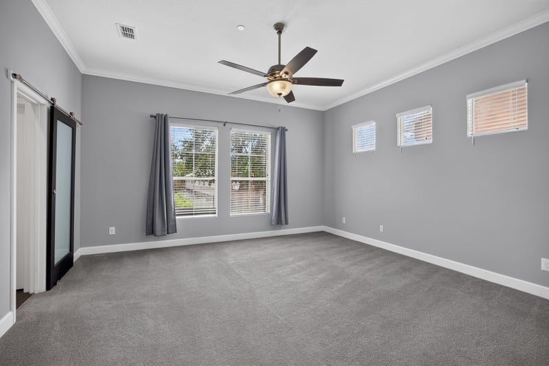 Upstairs room with carpet and ceiling fan at 6217 Eclipse Cir, Jacksonville, FL 32258