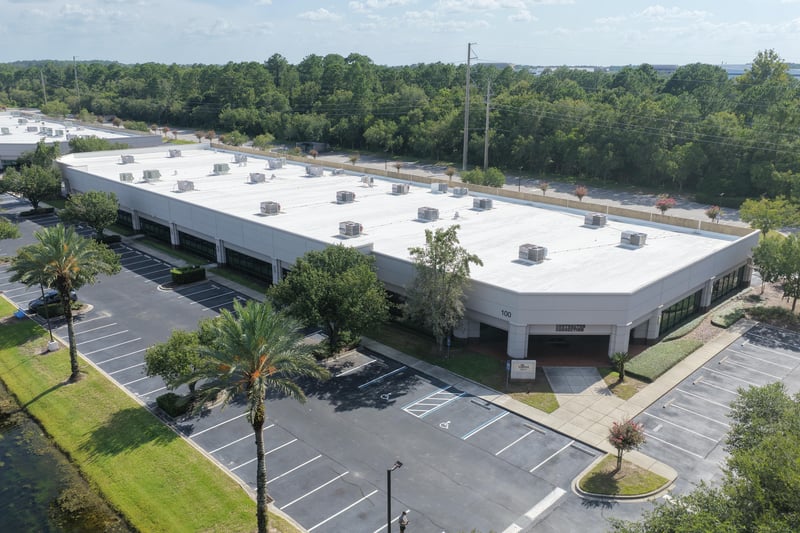 Aerial view of a building roofline bordered by parking at 10550 Deerwood Park Blvd, Jacksonville, FL 32256