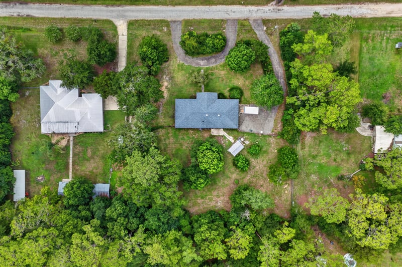 Aerial top-down view of the home and wooded lot at 3249 Maryland Ave, Green Cove Springs, FL