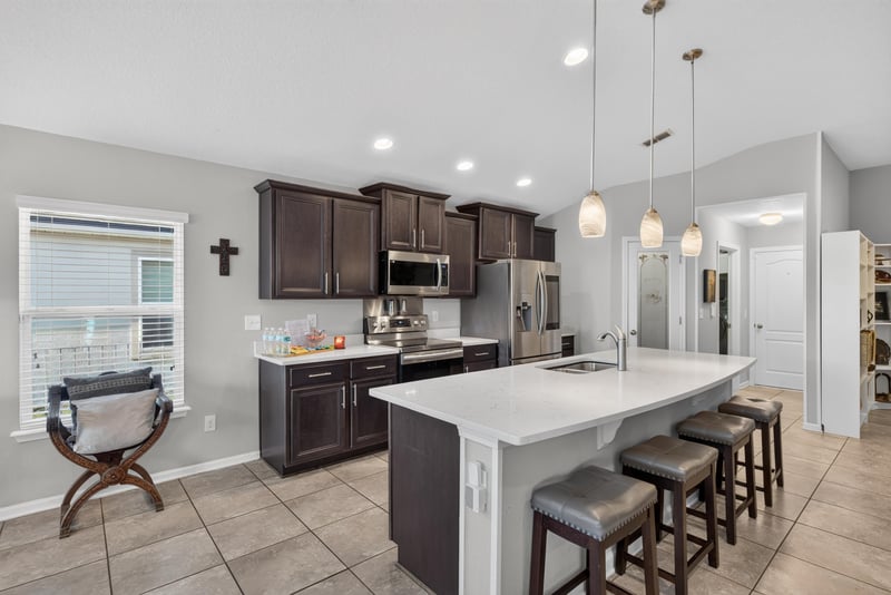 Kitchen with island and window over sink at 589 Seville Pkwy, St. Augustine, FL