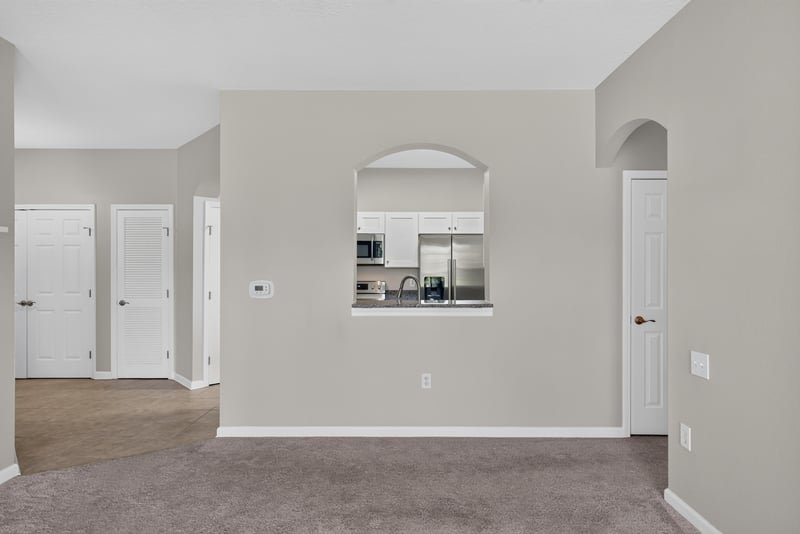Dining area with arched doorway at 7990 Baymeadows Rd E #404, Jacksonville, FL 32256