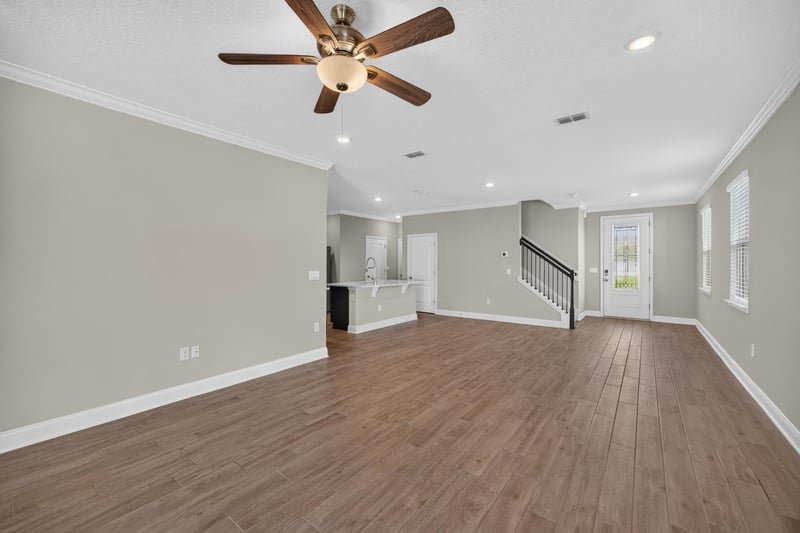 Living room with staircase view at 331 Millerstone Dr, St. Augustine, FL 32092