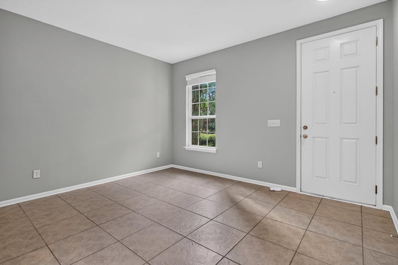 Empty front room with window and tile floor at 13685 Goodson Pl, Jacksonville, FL 32226