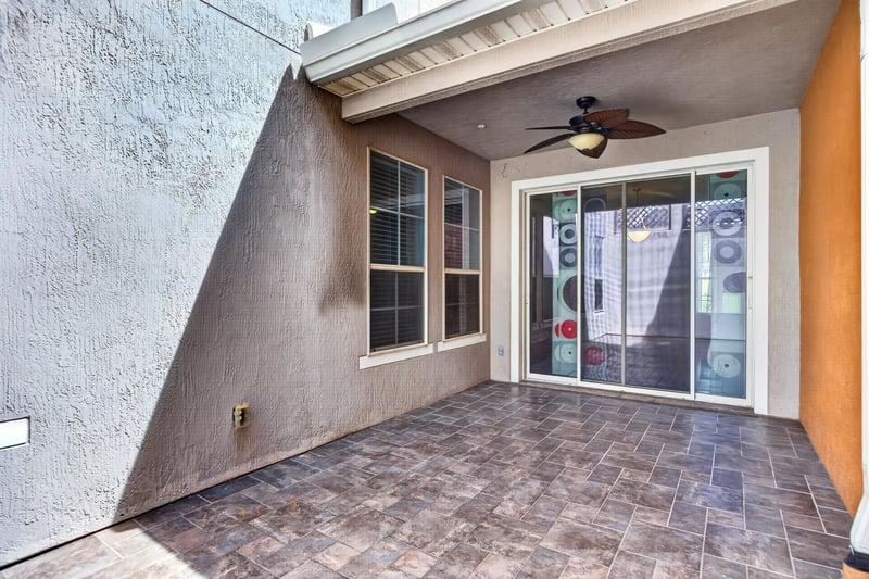 Covered patio with sliding glass door and ceiling fan at 6217 Eclipse Cir, Jacksonville, FL 32258