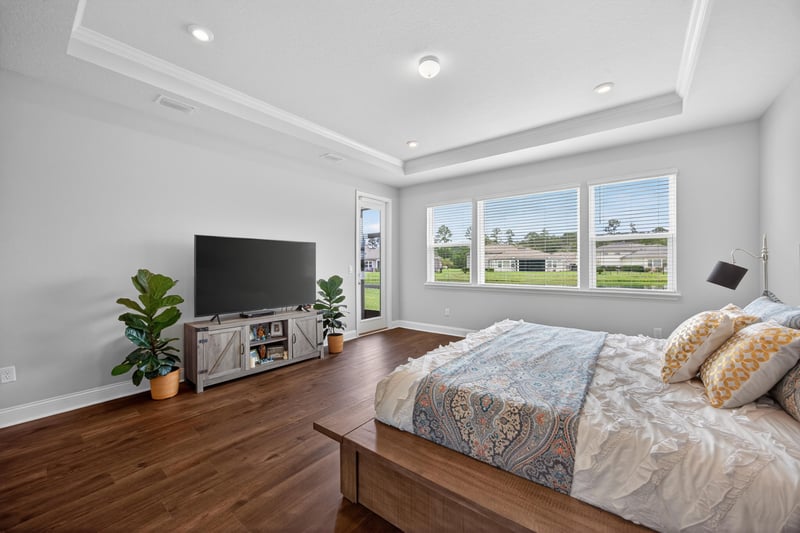 Bedroom with TV and windows at 85491 Fall River Pkwy, Fernandina Beach, FL 32034