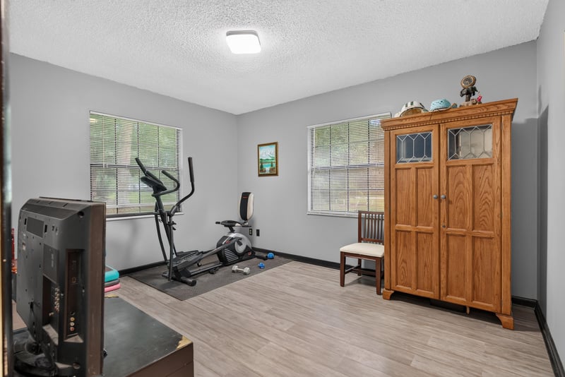Bedroom set up with exercise equipment at 3249 Maryland Ave, Green Cove Springs, FL