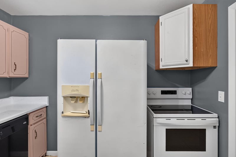 Kitchen corner with refrigerator and oak cabinet at 6745 Jack Horner Ln, Jacksonville, FL 32210