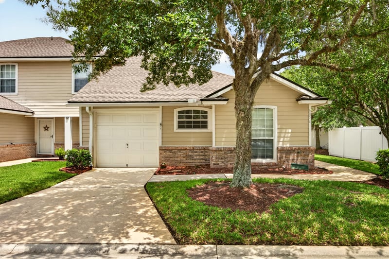 Front exterior of the townhouse row at 605 N Covered Bridge Rd, Jacksonville, FL