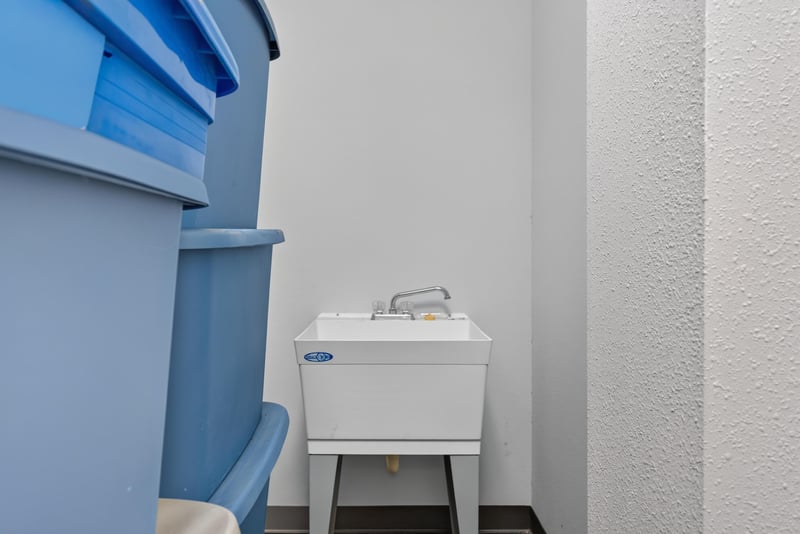 Utility area with blue cabinetry and sink at 1038 County Rd 315, Melrose
