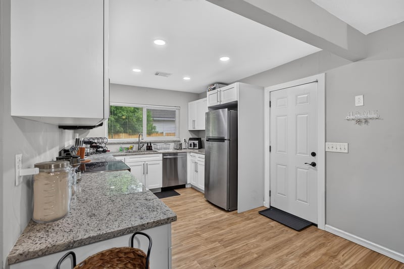 Kitchen view with window and pendant lighting at 9506 Harriet Ave, Jacksonville, FL 32208