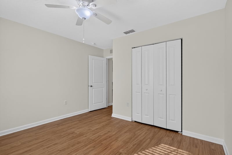 Bedroom with closet doors at 95221 Siena Ct, Fernandina Beach, FL 32034
