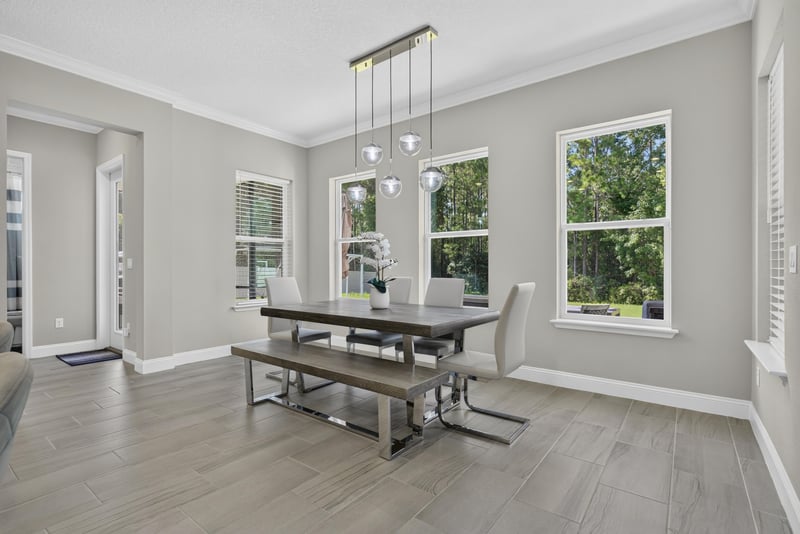 Breakfast nook with table and windows at 22 Azura Point