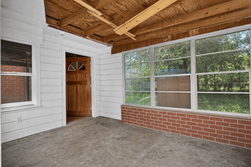 Screened porch interior of detached structure at 450 E 46th St, Jacksonville, FL 32208