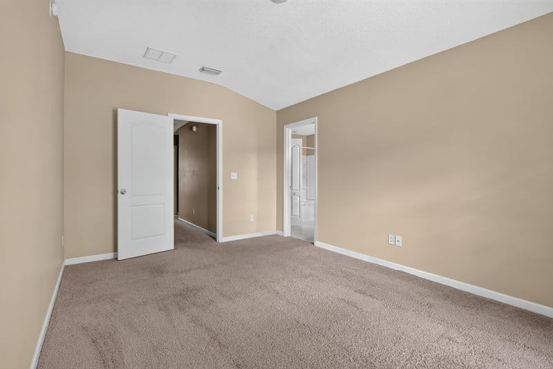 Bedroom with closet and passage doors at 12359 Mangrove Forest Ct, Jacksonville, FL 32218