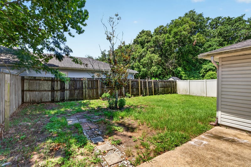 Fenced backyard with grass at 1108 Hidden Cove Cir S, Atlantic Beach, FL 32233