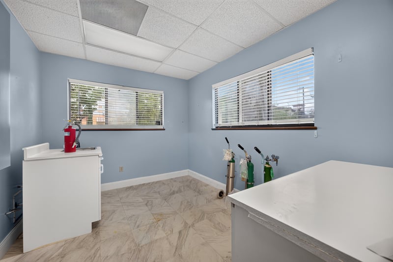 Room with built-in cabinet, window and fire extinguisher at 1543 Kingsley Ave #19, Orange Park, FL 32073