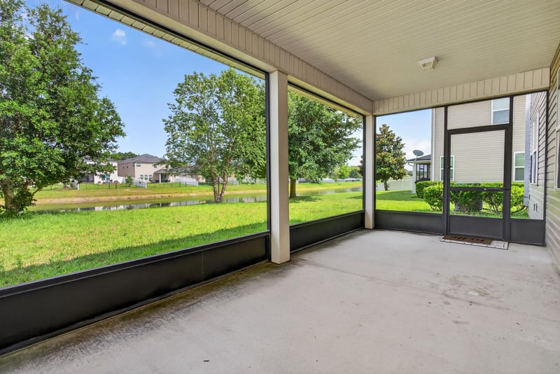 Screened and covered patio with yard view at 263 Gilmore Ln, Orange Park, FL 32065