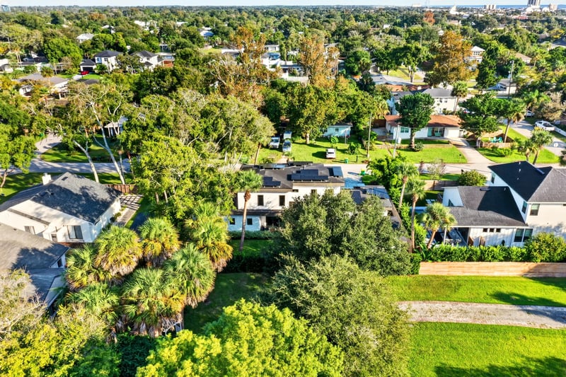 Aerial view of the neighborhood with distant skyline in Jacksonville Beach, FL