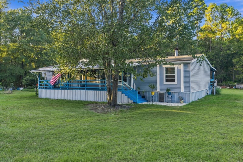 Front exterior with American flag, photographed by Megapixeler on Secret Cove Rd, Middleburg, FL