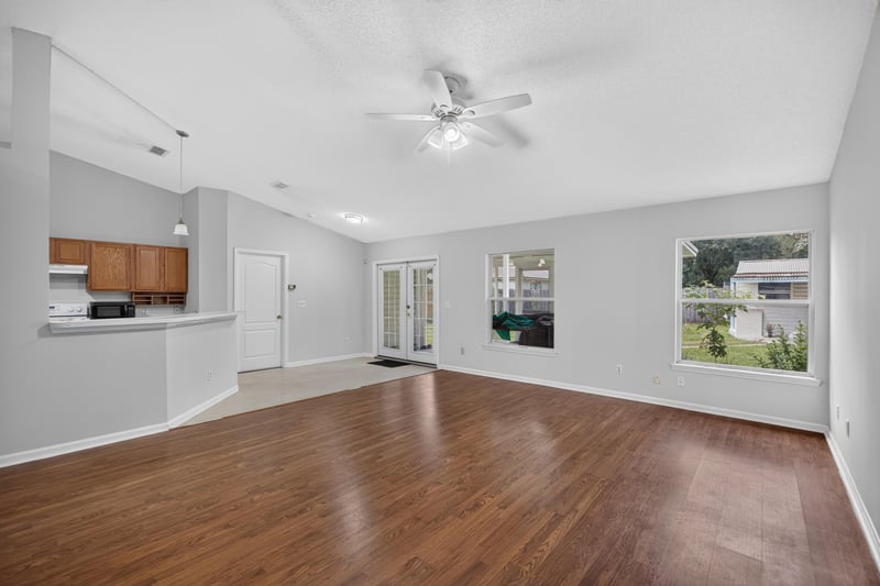 Living room with ceiling fan and windows at 9691 Nelson Forks Dr, Jacksonville, FL 32222