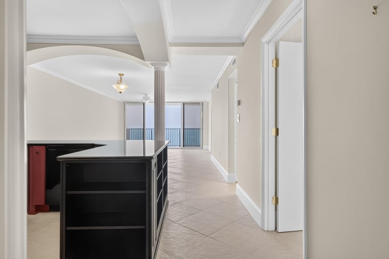 Hallway with black built-in shelving and arched doorway at 1301 1st St S
