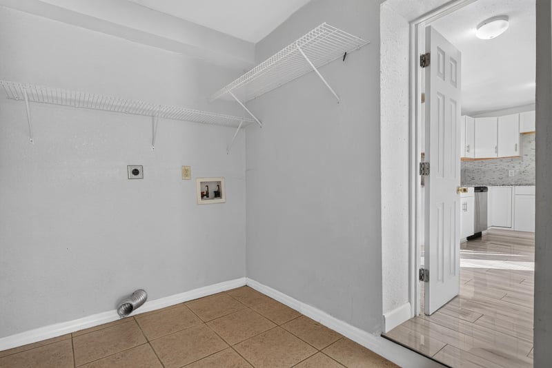 Laundry hallway with tile flooring at 442 Ameca Ave, Orange Park, FL 32073