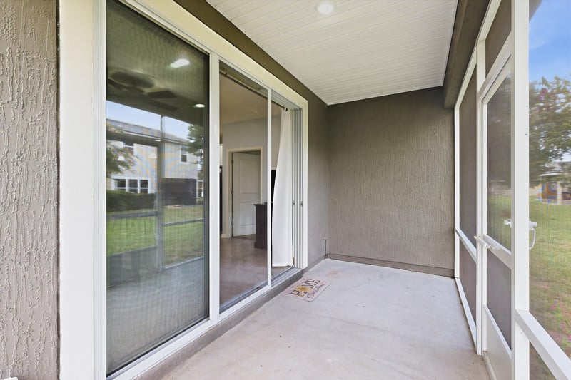 Screened porch with sliding glass door entry at 2378 Caney Oaks Dr, Jacksonville, FL