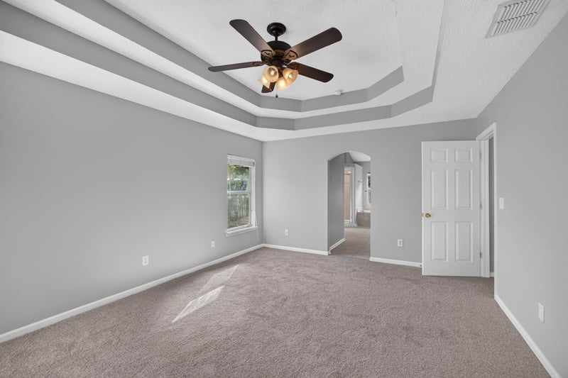 Bedroom with tray ceiling and carpet at 470 Sparrow Branch Cir, Jacksonville, FL 32259